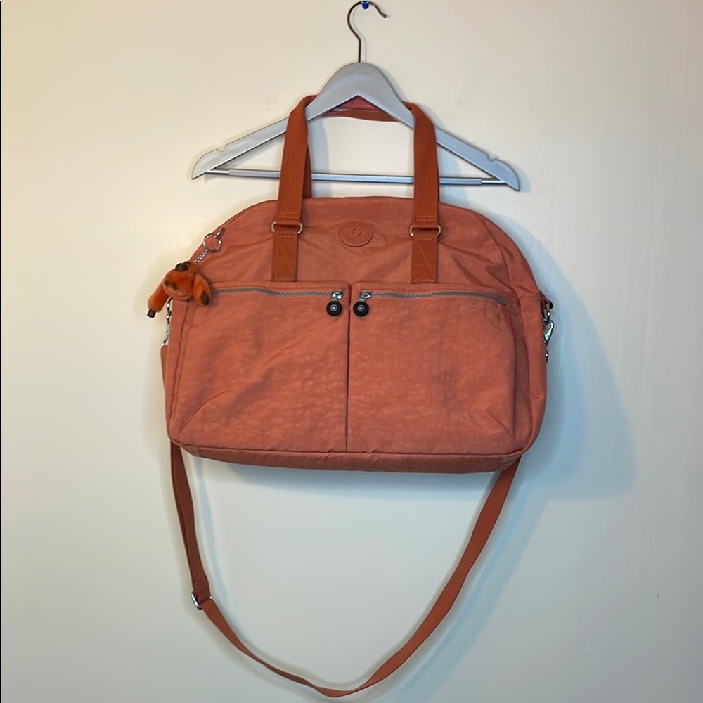 Kipling Orange Travel Bag with Zipper Closure and Adjustable Strap